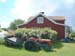 Traktor infront of an original Harstena house